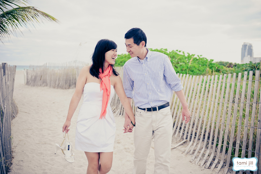 Couple walks on South Beach for engagement photo shoot.