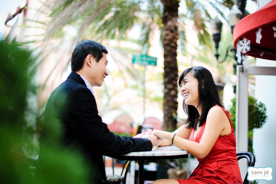 Couple enjoying coffee at South Beach cafe.