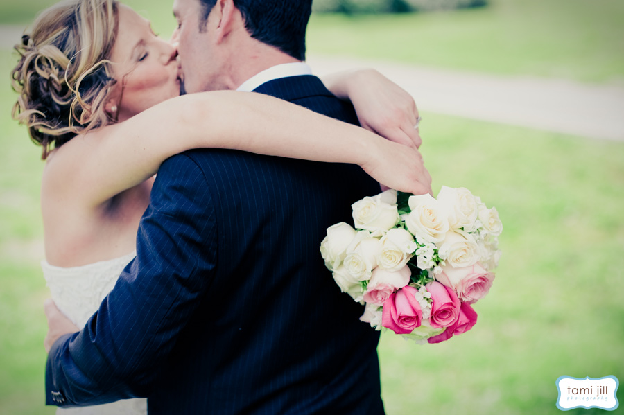 Bride and Groom kiss on the Galuppis golf course.