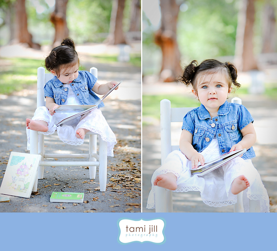 Toddler plays with book in a Aventura Park.