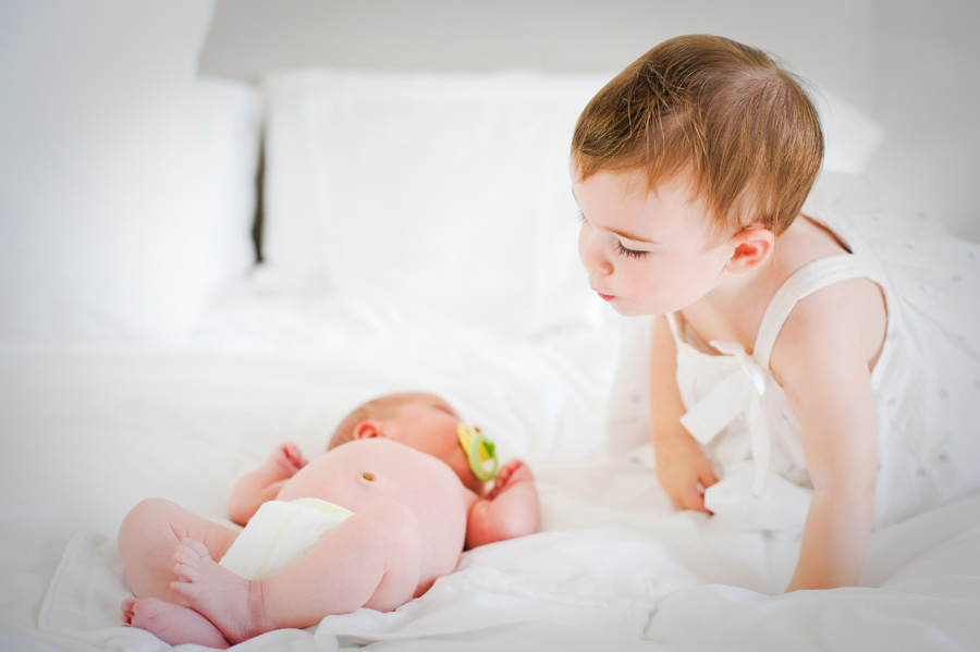 Siblings during newborn photography session. Siblings during newborn photography session.