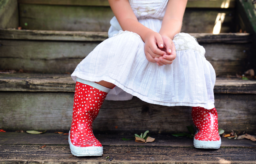 Red boots were used as a prop for a ft. lauderdale child photography session.