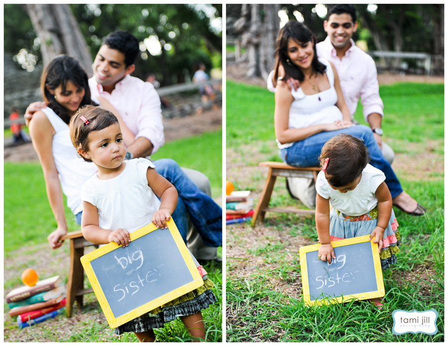 Child poses with chalkboard during a Family Photo session in Miami.