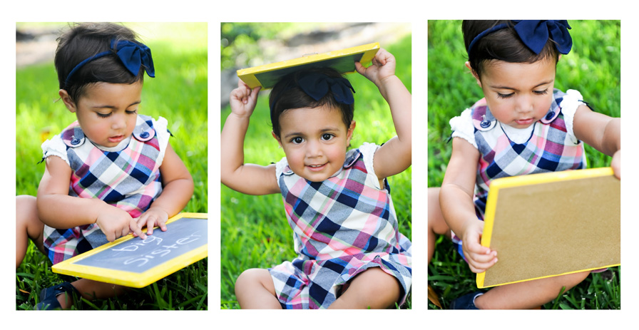 Girl plays with chalkboard during a family photography session in Miami