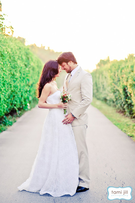 Bride and groom pose in the sunlight at a gorgeous wedding in Davie, Florida.