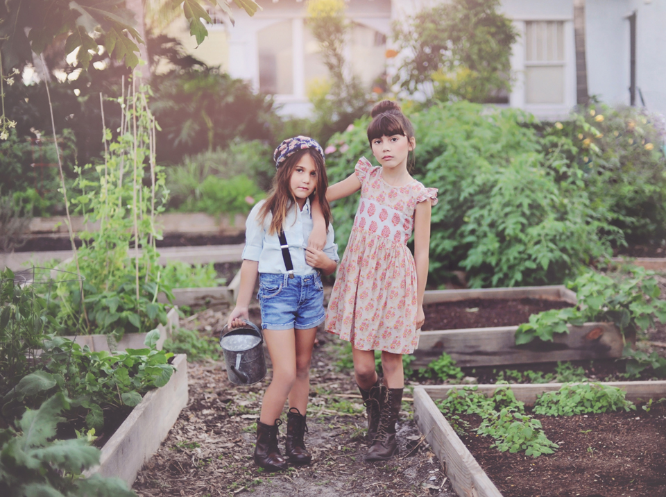 Sisters in the garden for miami child model photographer.