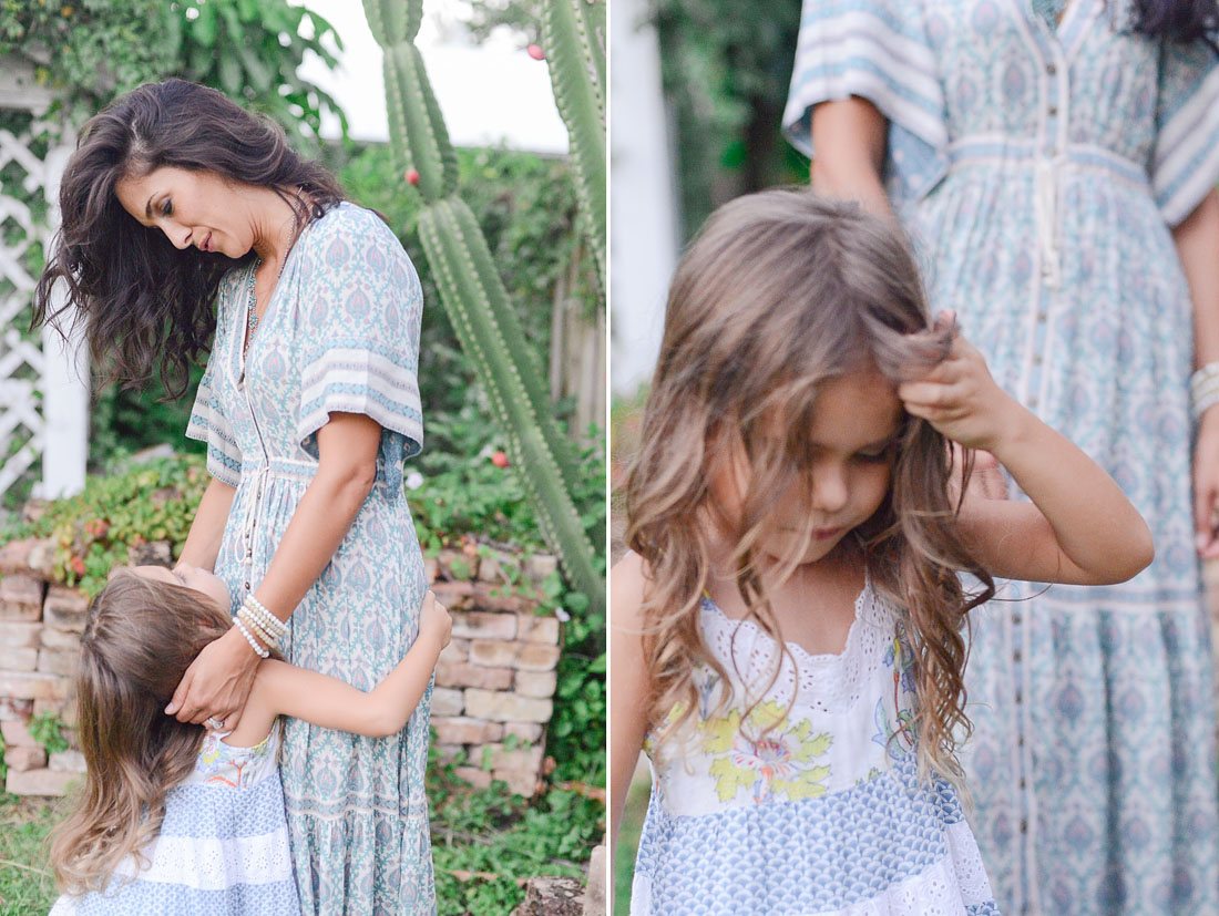 Mother and daughter play in backyard.