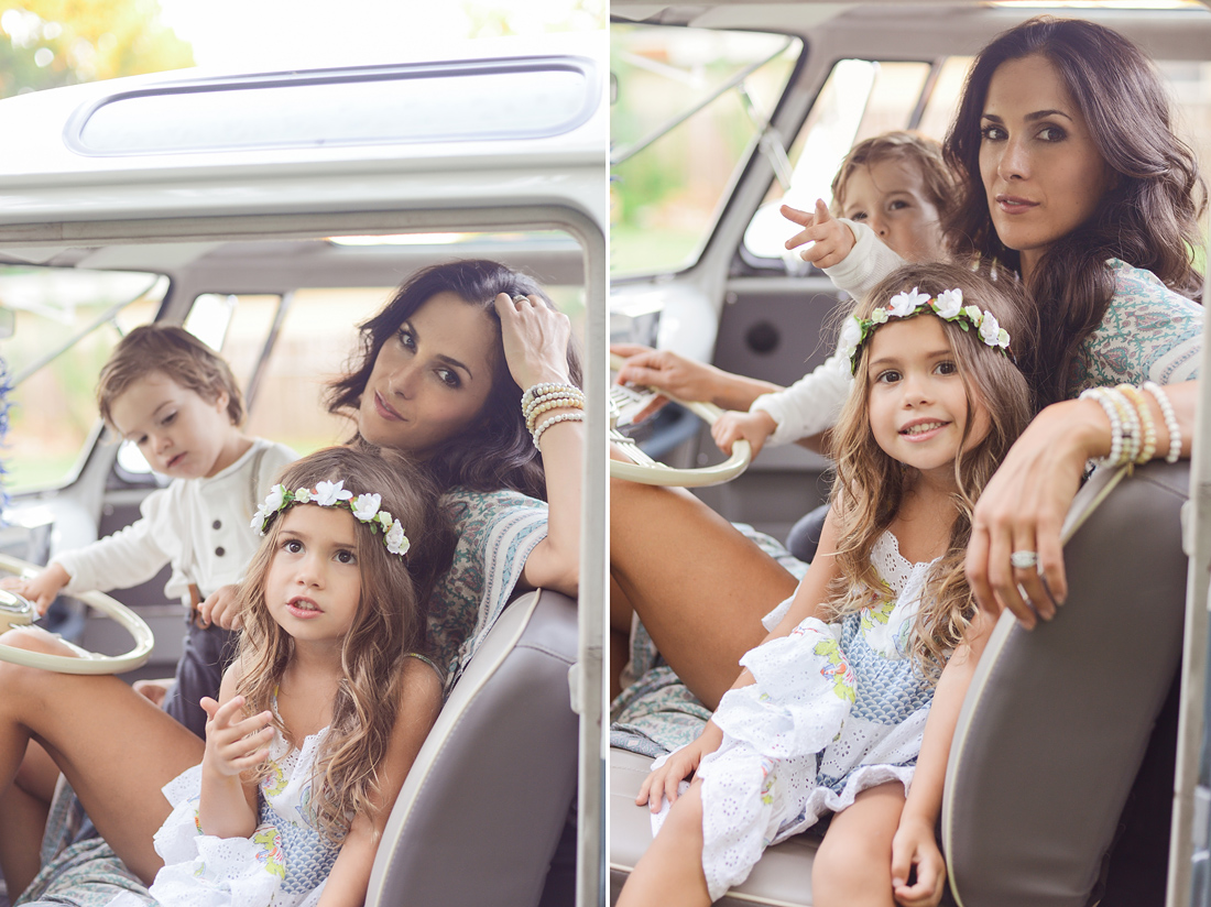 Mother poses with children in VW Bus.