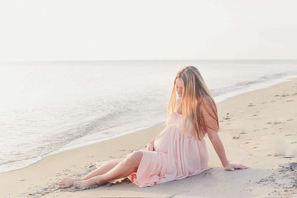 Beautiful maternity photo of woman on miami beach.